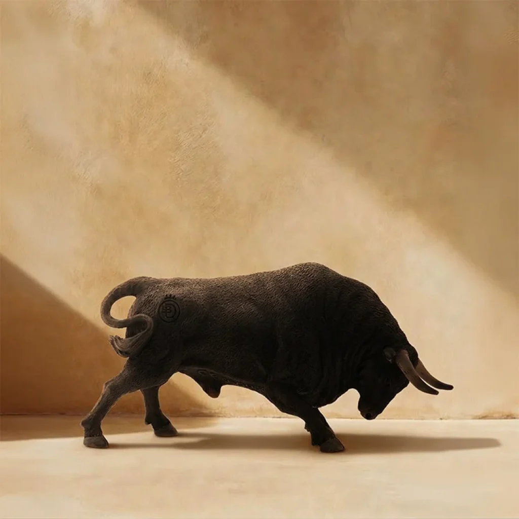 Toro agachado negro zaino miniatura